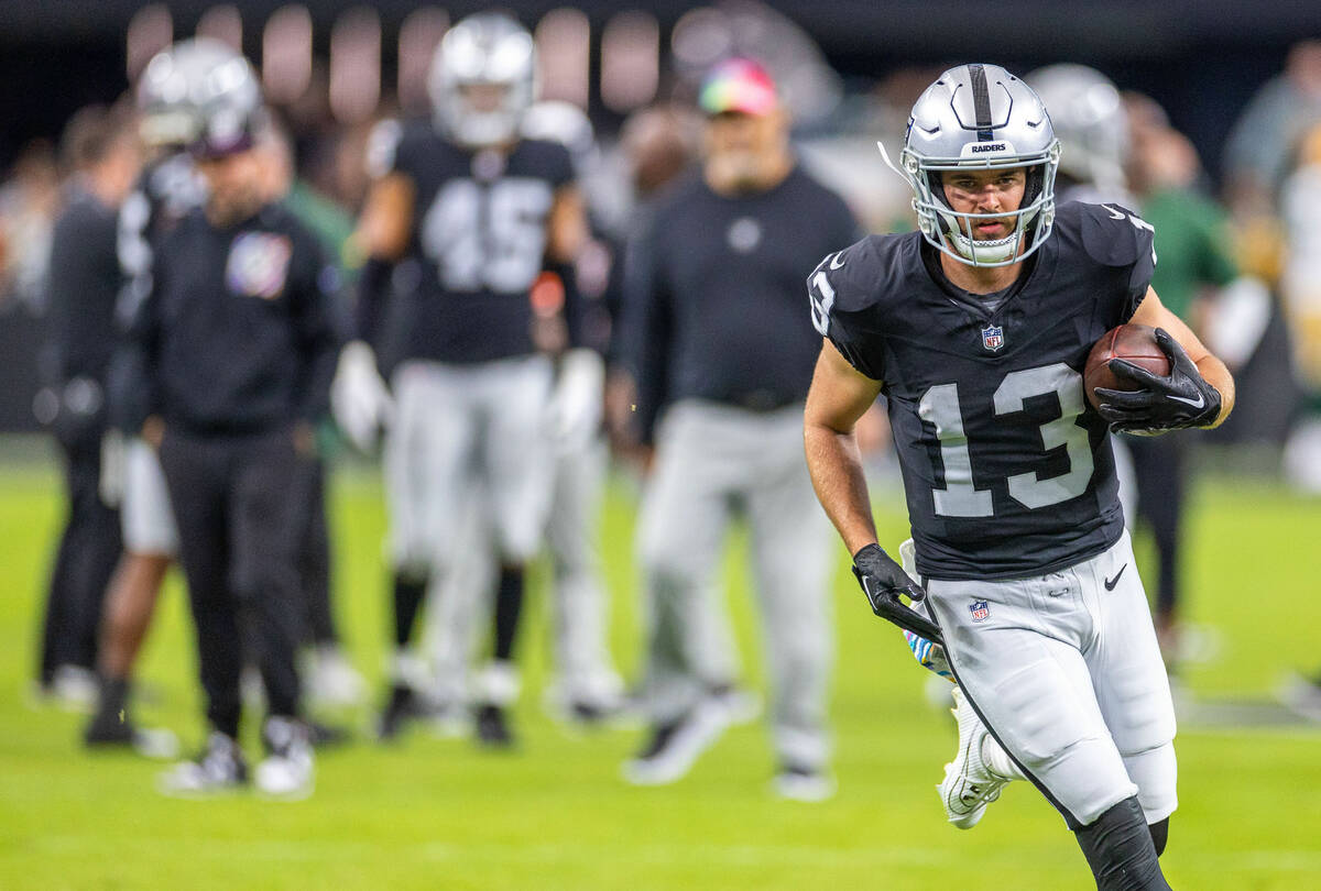 Raiders wide receiver Hunter Renfrow (13) runs after a reception during warm ups before facing ...