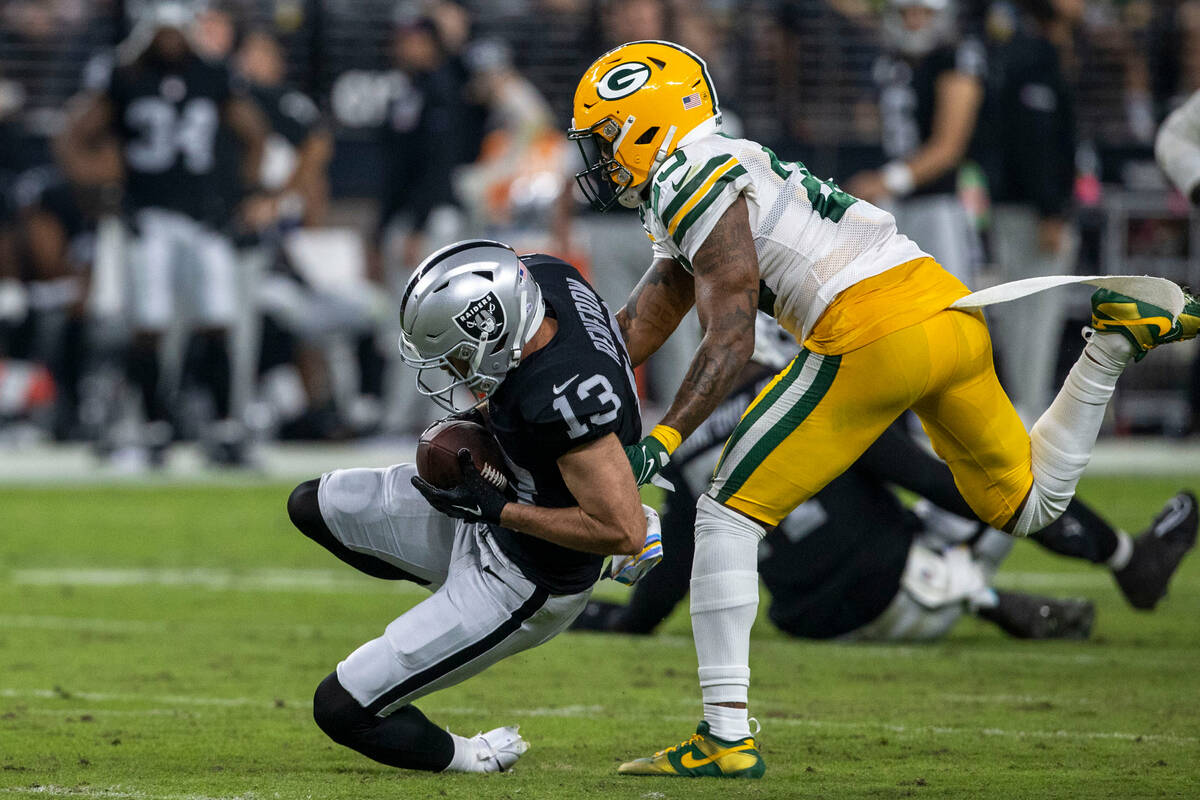 Raiders wide receiver Hunter Renfrow (13) makes a catch as Green Bay Packers cornerback Rasul ...