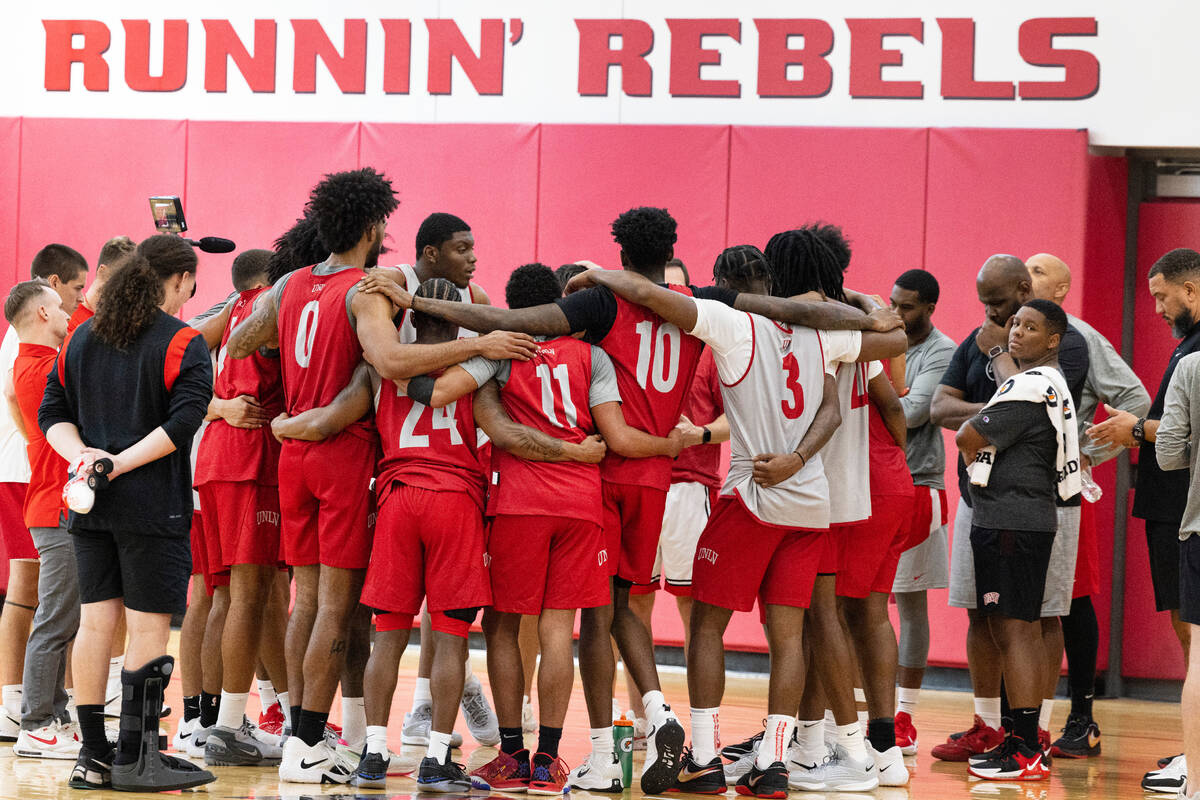 UNLV's basketball players gathered to listen to their coach Kevin Kruger after team practice, o ...