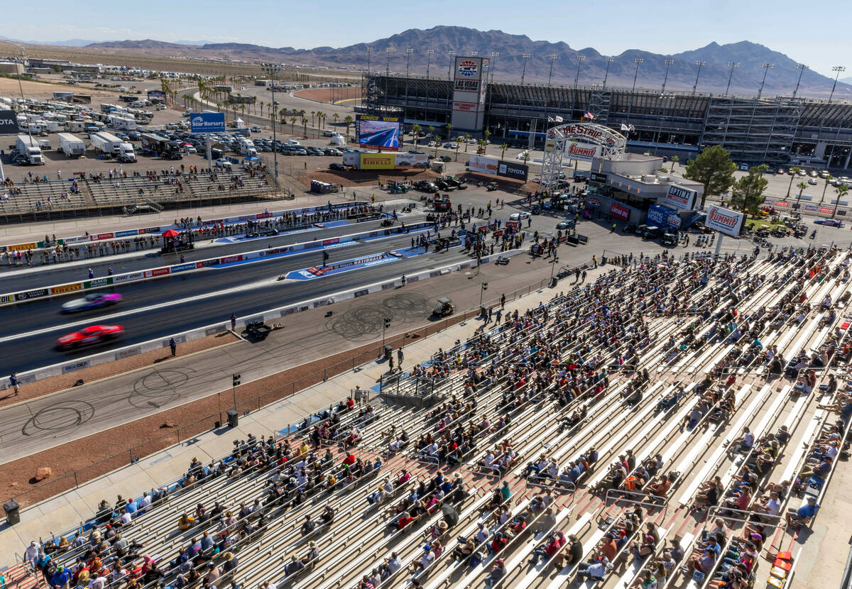 Fans watch during a qualifying session in the NHRA Nevada Nationals at The Strip at Las Vegas M ...