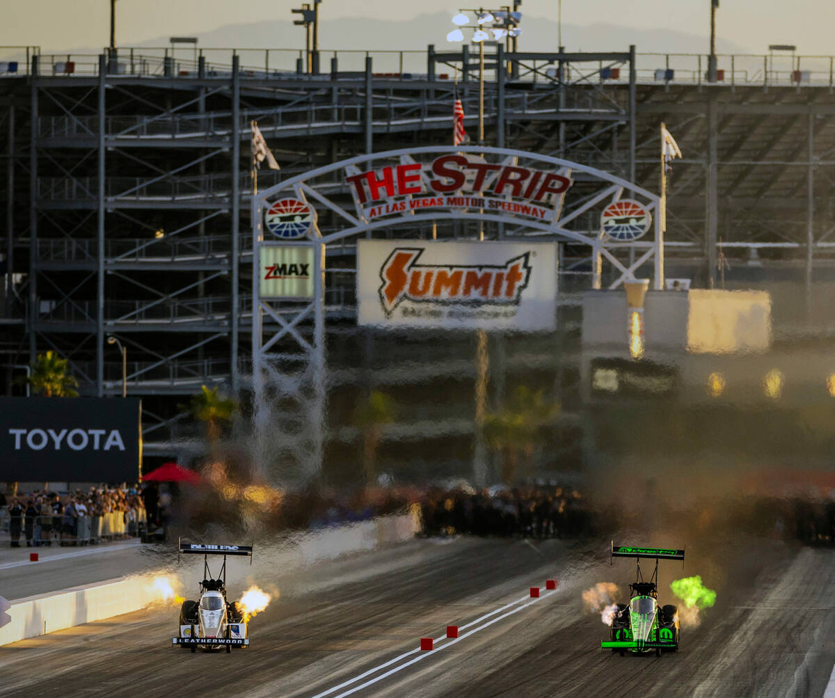 Top Fuel racer Leah Pruett, right, goes head to head with Justin Ashley during a qualifying ses ...