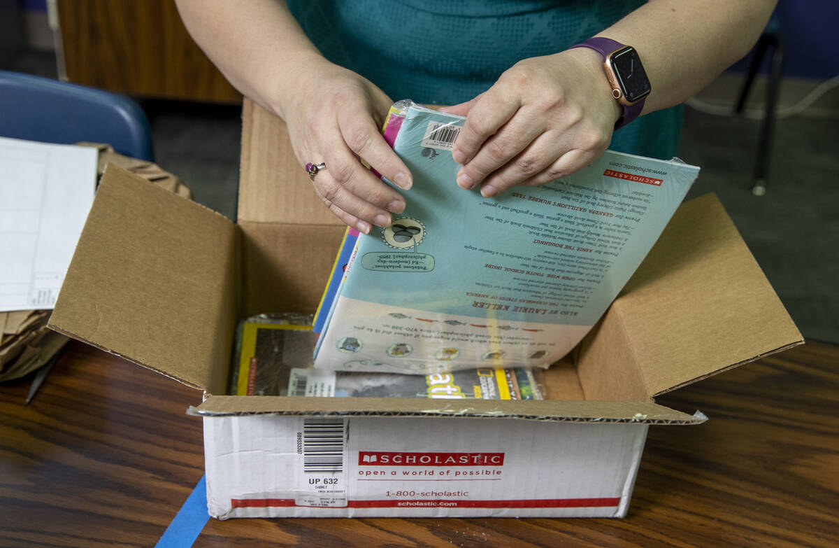 Long STEAM Academy teacher Shana Prue just received boxes of school supplies including books an ...