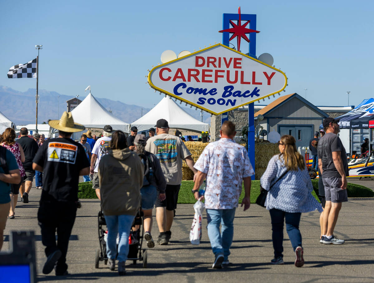 Fans walk towards the exit during a qualifying session in the NHRA Nevada Nationals at The Stri ...