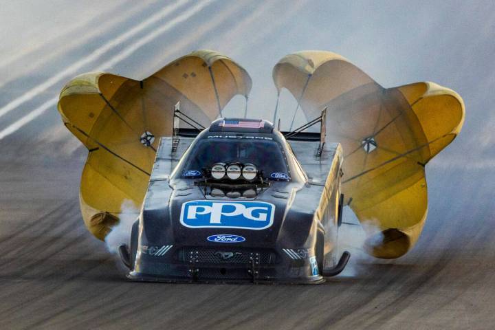 Bob Tasca III deploys his parachute during a Funny Car qualifying session in the NHRA Nevada Na ...