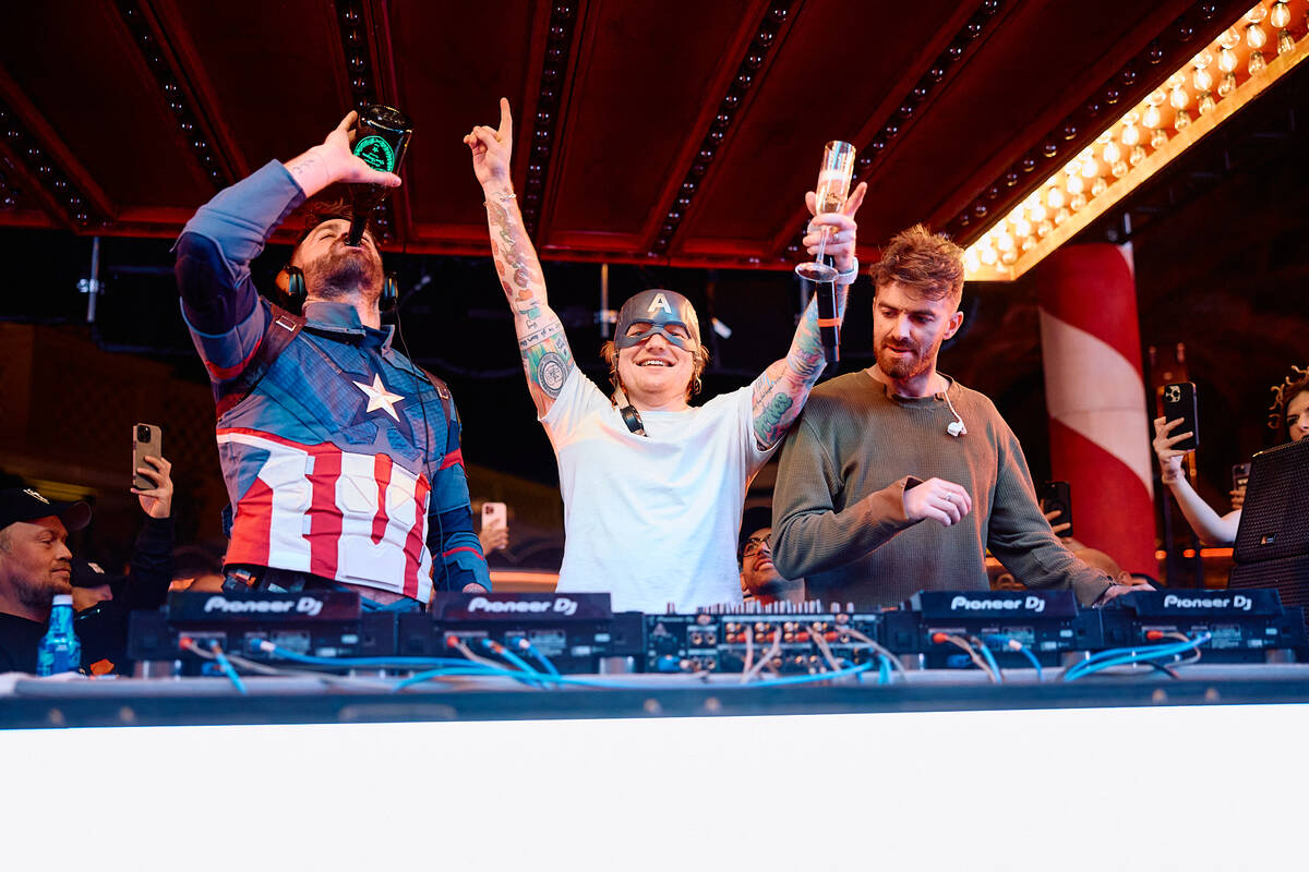 Alex Pall, left, and Drew Taggart of the The Chainsmokers perform with Ed Sheeran at XS Nightcl ...