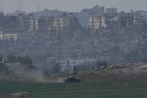 Israeli tanks take position along the Israeli border with the Gaza Strip, as seen from southern ...