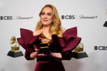 Adele, winner of the award for best pop solo performance for "Easy on Me," poses in t ...