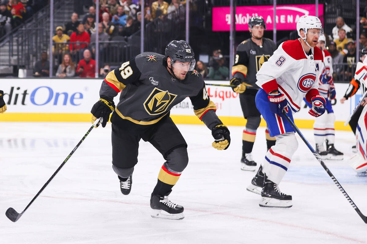 Golden Knights center Ivan Barbashev (49) and Montreal Canadiens defenseman Mike Matheson (8) s ...