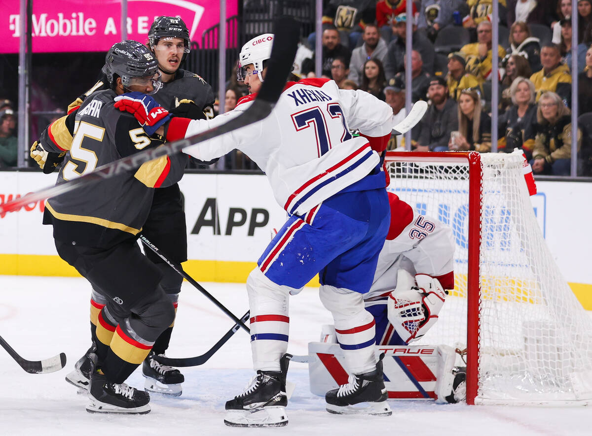 Montreal Canadiens defenseman Arber Xhekaj (72) shoves Golden Knights right wing Keegan Kolesar ...