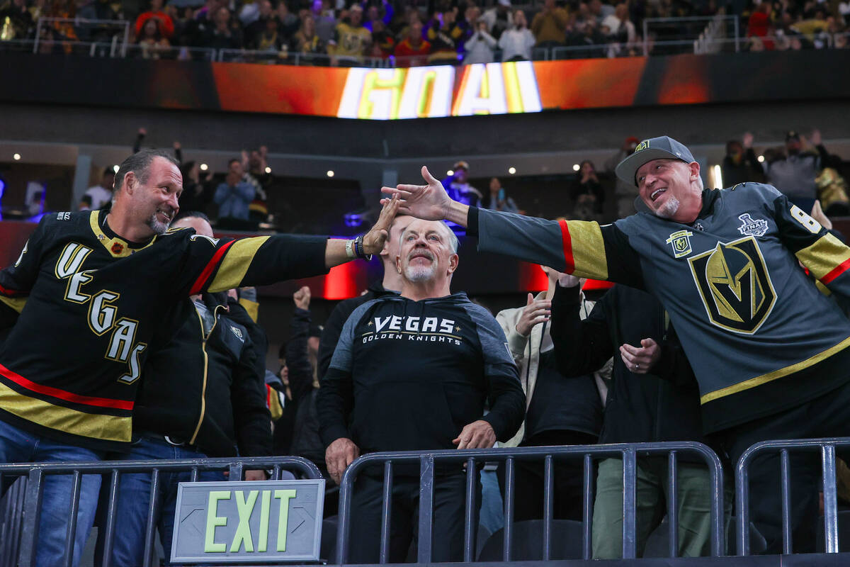 Golden Knights fans celebrate the second goal made by the Golden Knights in a NHL game against ...