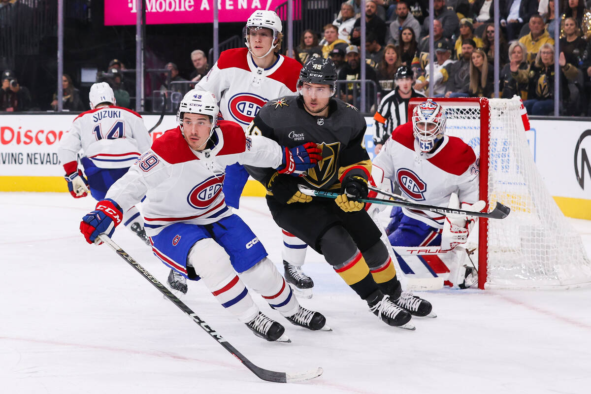 Golden Knights center Ivan Barbashev (49) and Montreal Canadiens left wing Rafael Harvey-Pinard ...