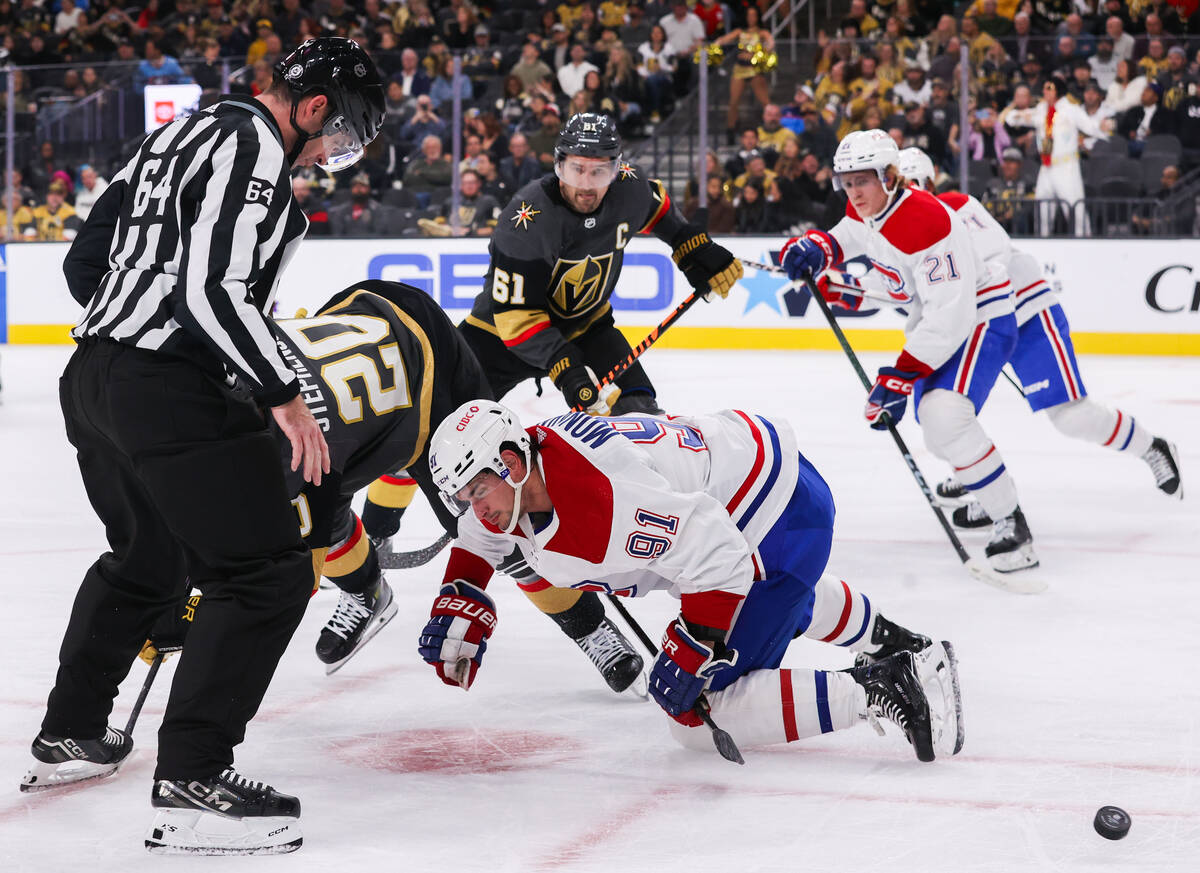 Montreal Canadiens center Sean Monahan (91) falls while fighting for the puck with Golden Knigh ...