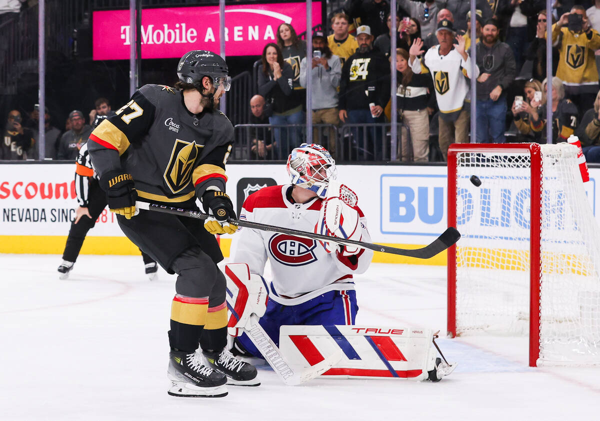 Golden Knights defenseman Shea Theodore (27) makes the winning goal against Montreal Canadiens ...