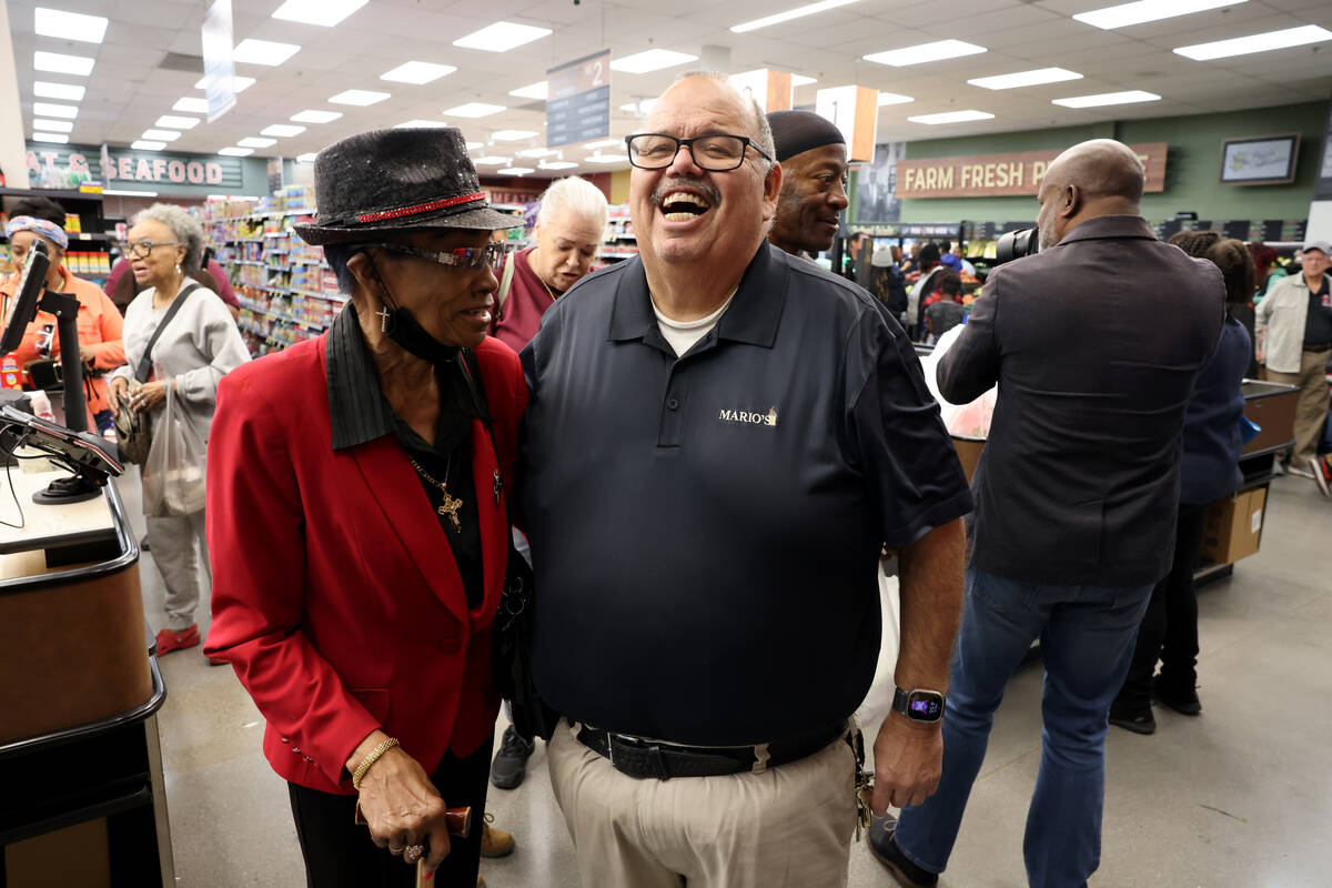 Owner and namesake Mario Berlanga, right, is congratulated by longtime customer Erma Walker dur ...