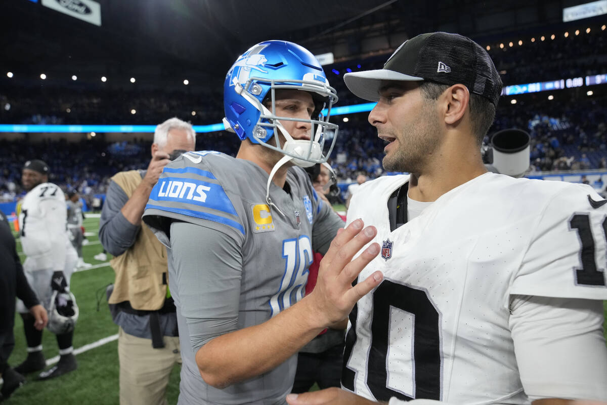 Detroit Lions quarterback Jared Goff (16) greets Las Vegas Raiders quarterback Jimmy Garoppolo ...