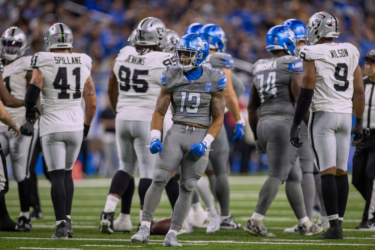 Detroit Lions running back Craig Reynolds (13) celebrates his catch against the Raiders during ...
