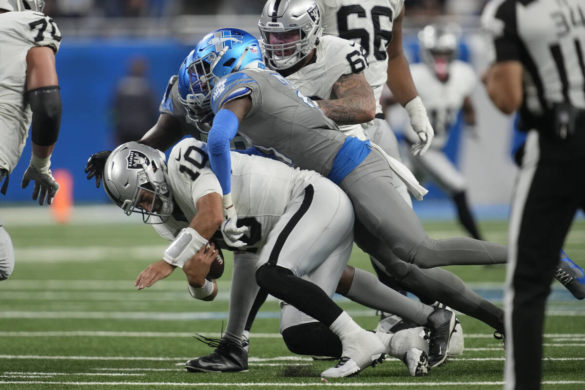 Detroit Lions safety Tracy Walker III (21) sacks Las Vegas Raiders quarterback Jimmy Garoppolo ...