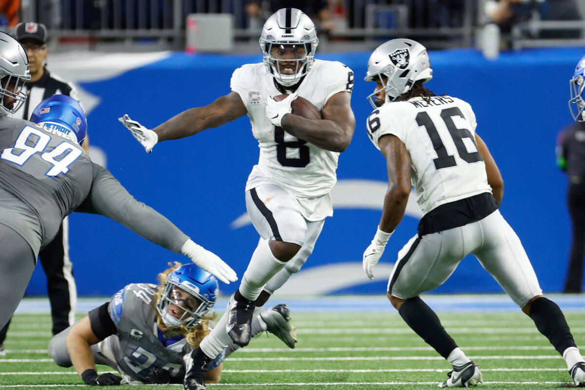 Las Vegas Raiders running back Josh Jacobs (8) rushes against the Detroit Lions in the first ha ...