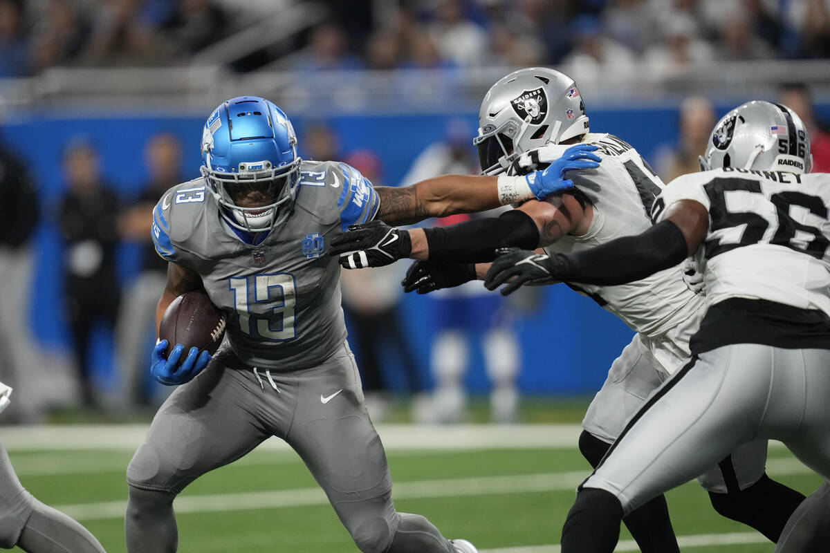 Detroit Lions running back Craig Reynolds rushes during the second half of an NFL football game ...