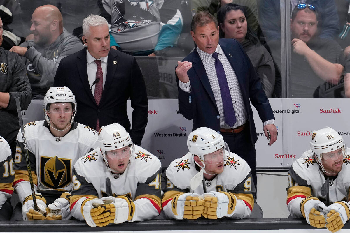 Vegas Golden Knights coach Bruce Cassidy, back right, gestures from the bench during the third ...