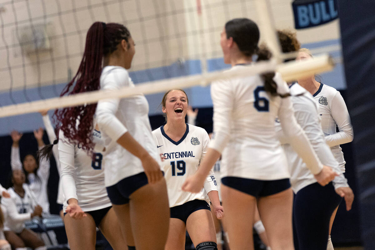 Centennial celebrates with opposite Londyn Wipperman (19) after they scored on Faith Lutheran d ...