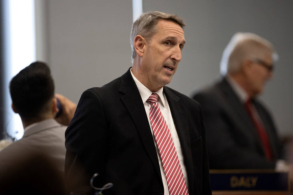 State Sen. Scott Hammond, R-Las Vegas, speaks with fellow senators before a meeting of the Sena ...