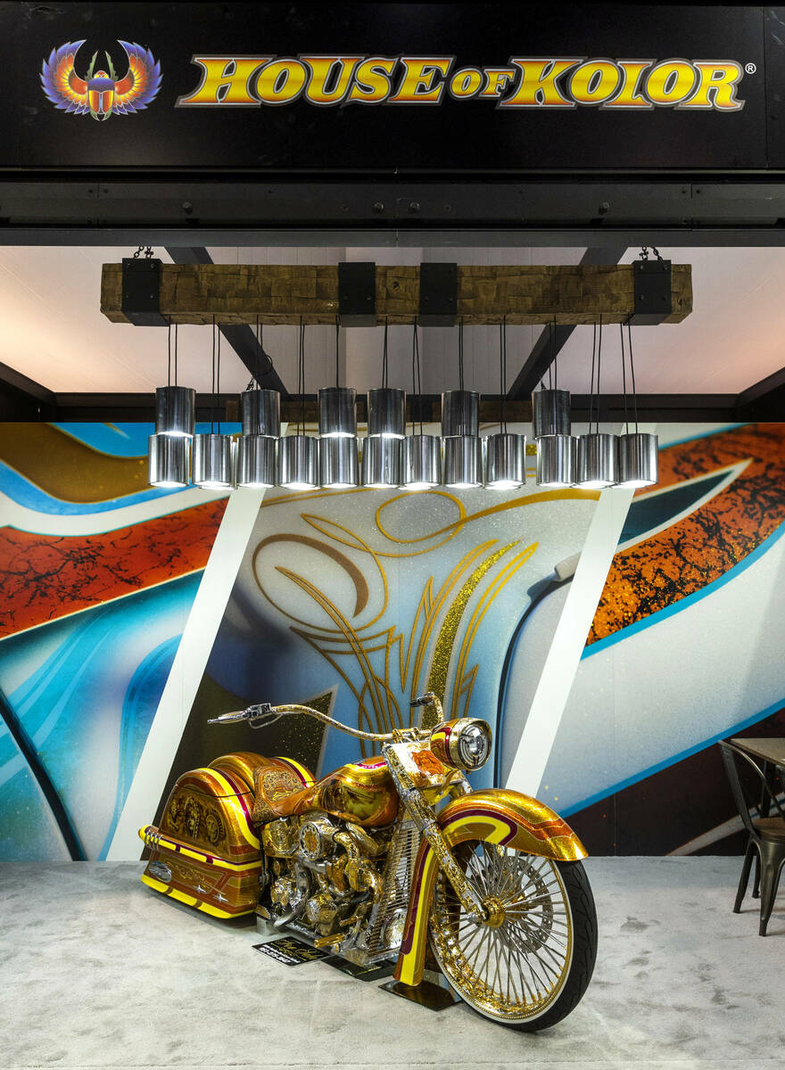 The House of Color shows off a custom motorcycle paint job during the first day of SEMA at the ...