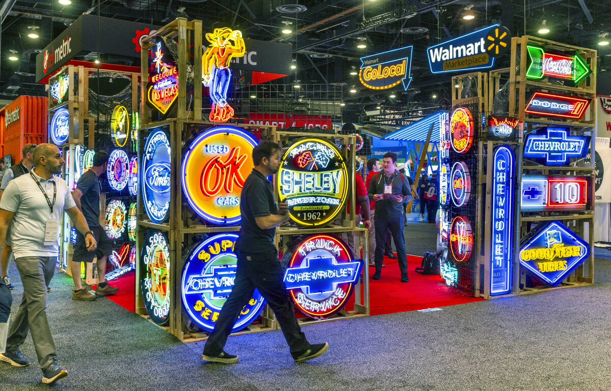 Neonetics create new neon signs in a classic style during the first day of SEMA at the Las Vega ...