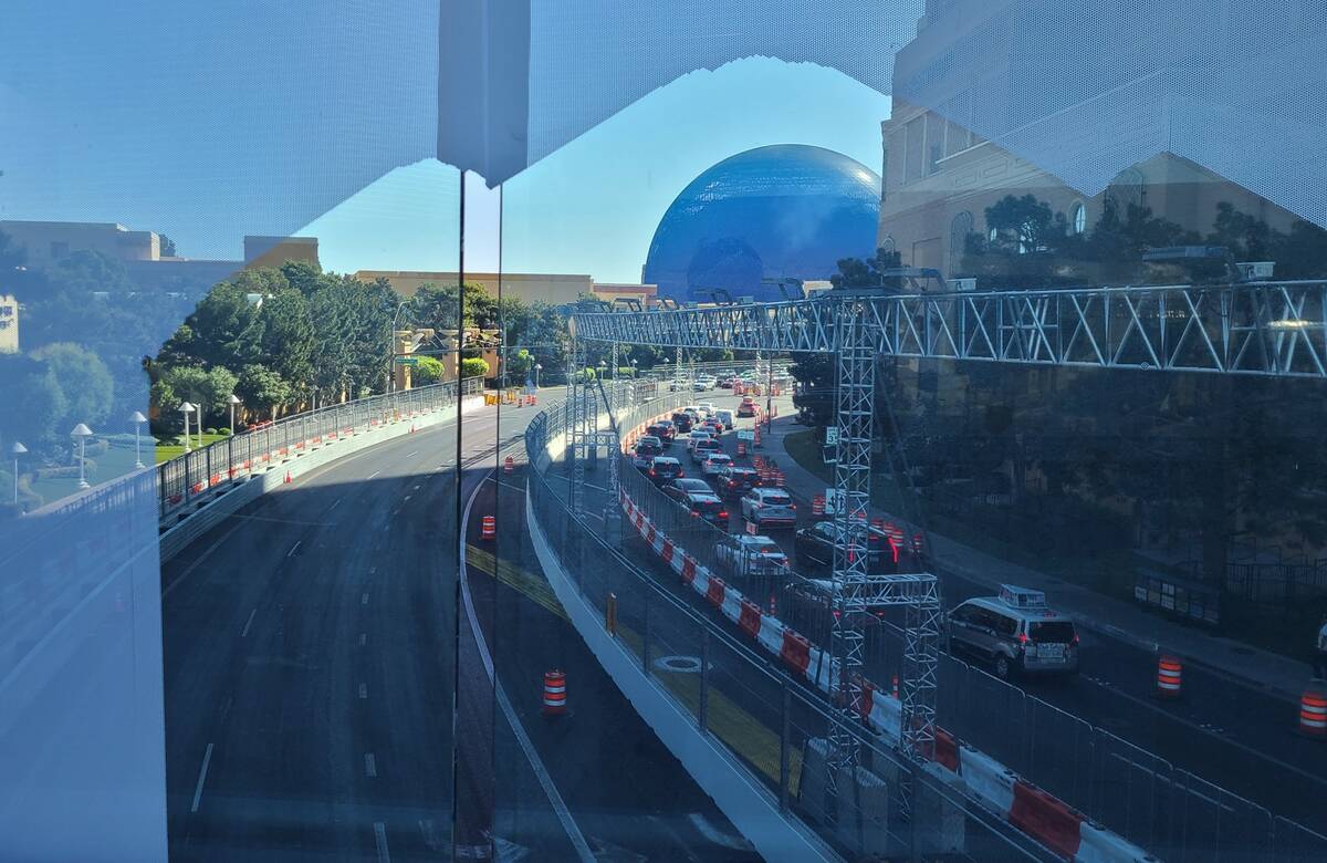 A view of the Sphere through the glass of a pedestrian overpass over Sands Avenue between Wynn ...