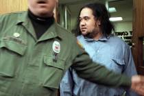 Convicted killer Siaosi Vanisi, escorted by a Nevada State Prison guard, enters court Friday, J ...