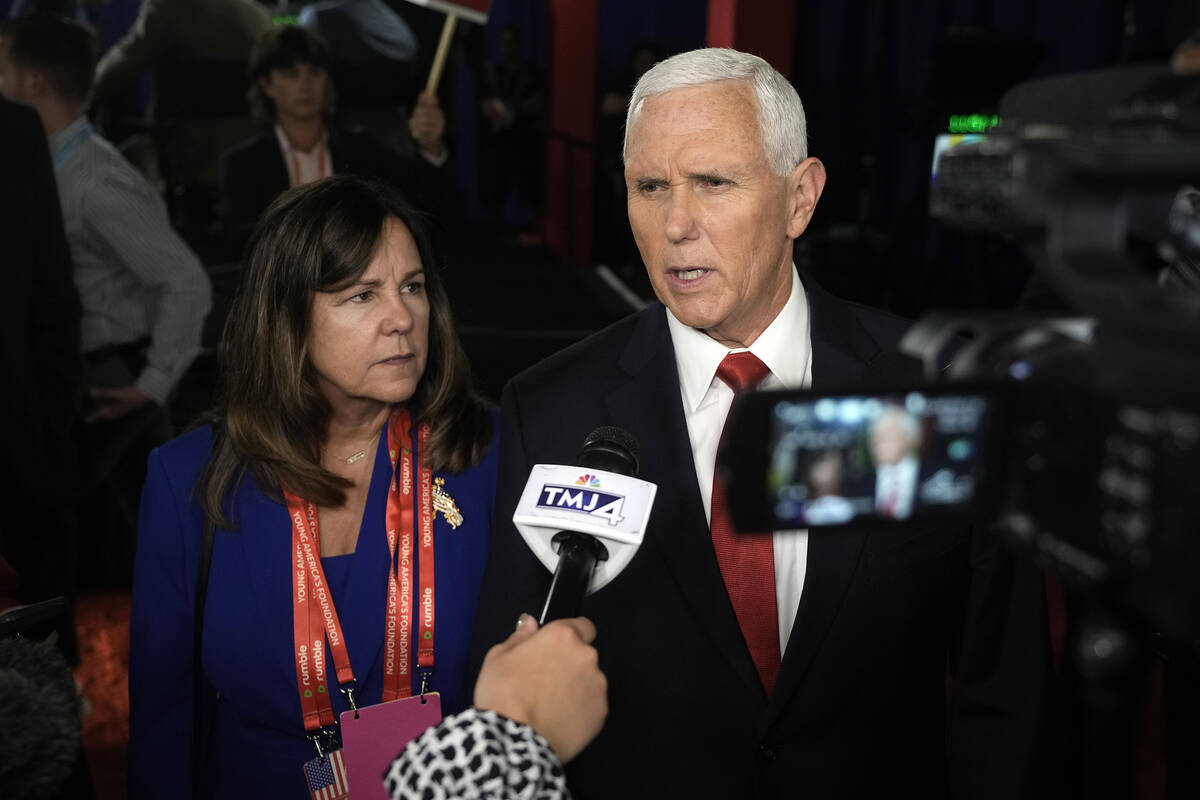 Former Vice President Mike Pence talks to reporters. (AP Photo/Morry Gash)