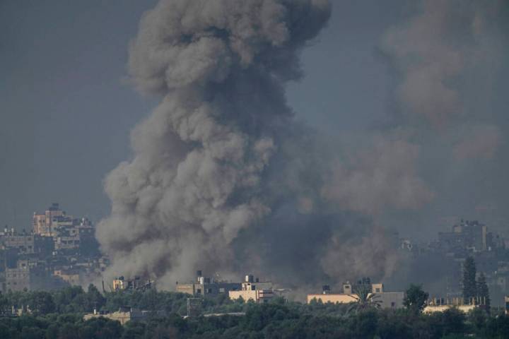 Smoke rises following an Israeli airstrike in the Gaza Strip, as seen from southern Israel, Wed ...