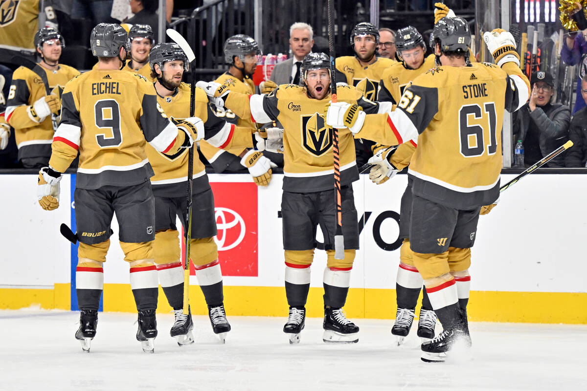 Vegas Golden Knights right wing Jonathan Marchessault, center, celebrates after his power play ...