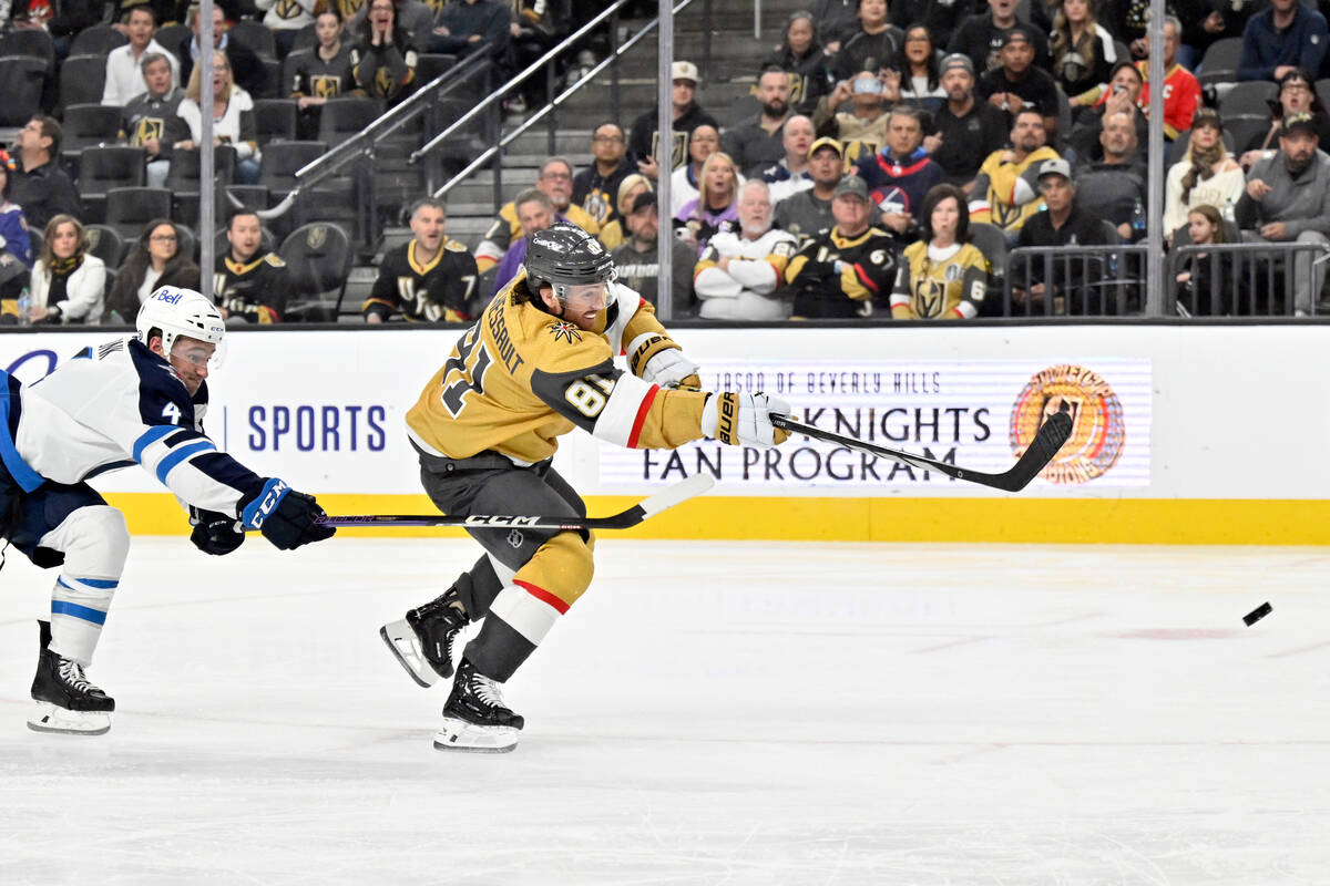 Vegas Golden Knights right wing Jonathan Marchessault (81) shoots against Winnipeg Jets defense ...