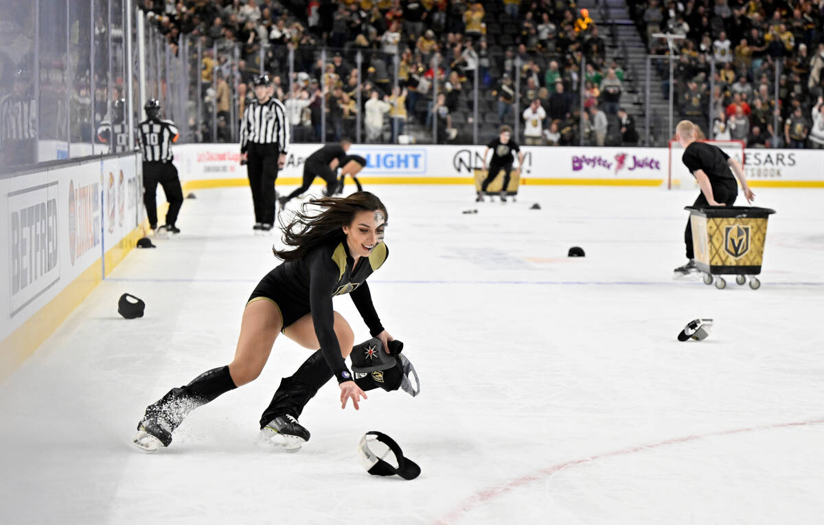 Members of the Knights Guard takes hats off the ice after Vegas Golden Knights right wing Jonat ...