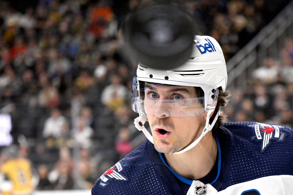 Winnipeg Jets center Mark Scheifele (55) watches the puck during the second period of an NHL ho ...