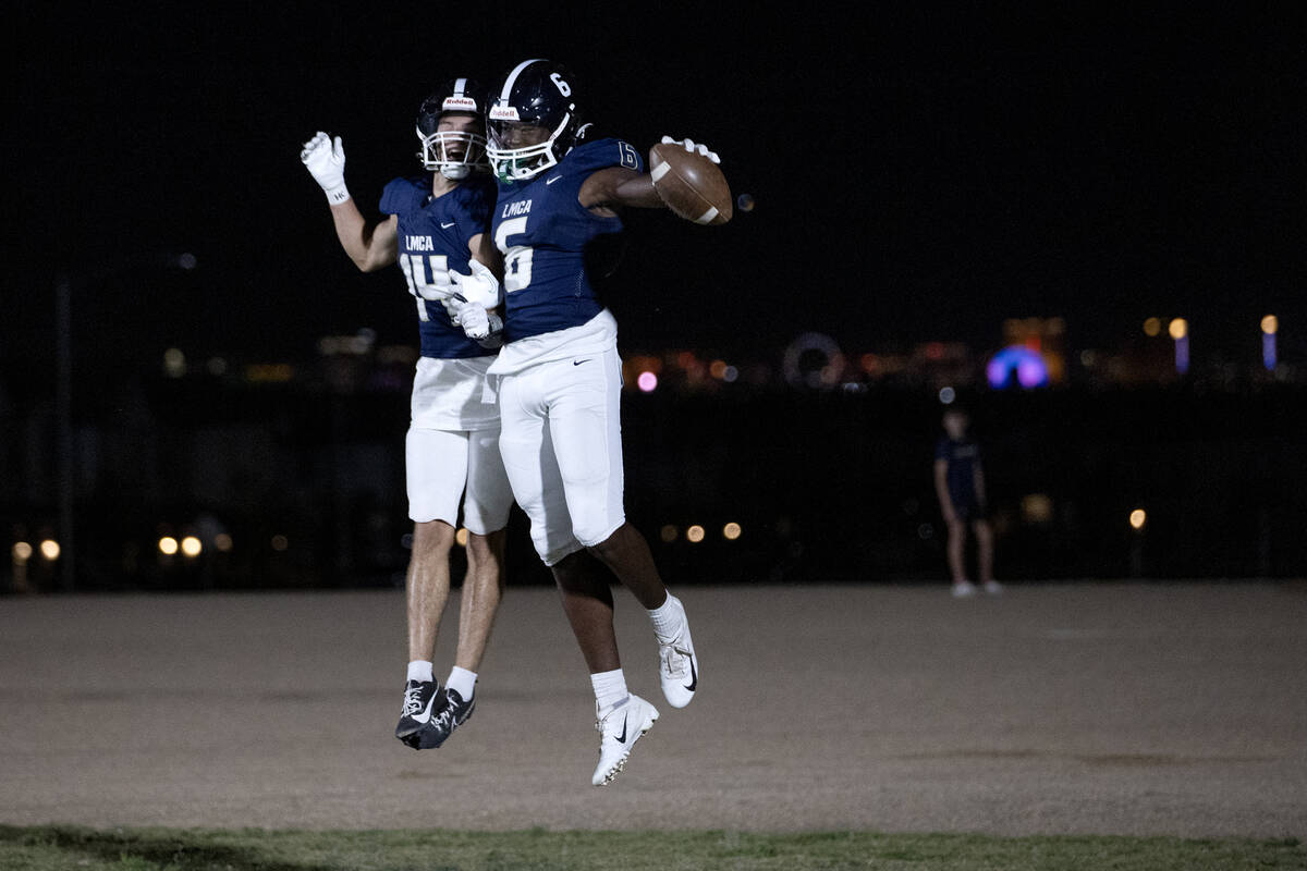 Lake Mead wide receivers Christian Rhodes (14) and Jaylen Hardy (6) celebrate a touchdown durin ...