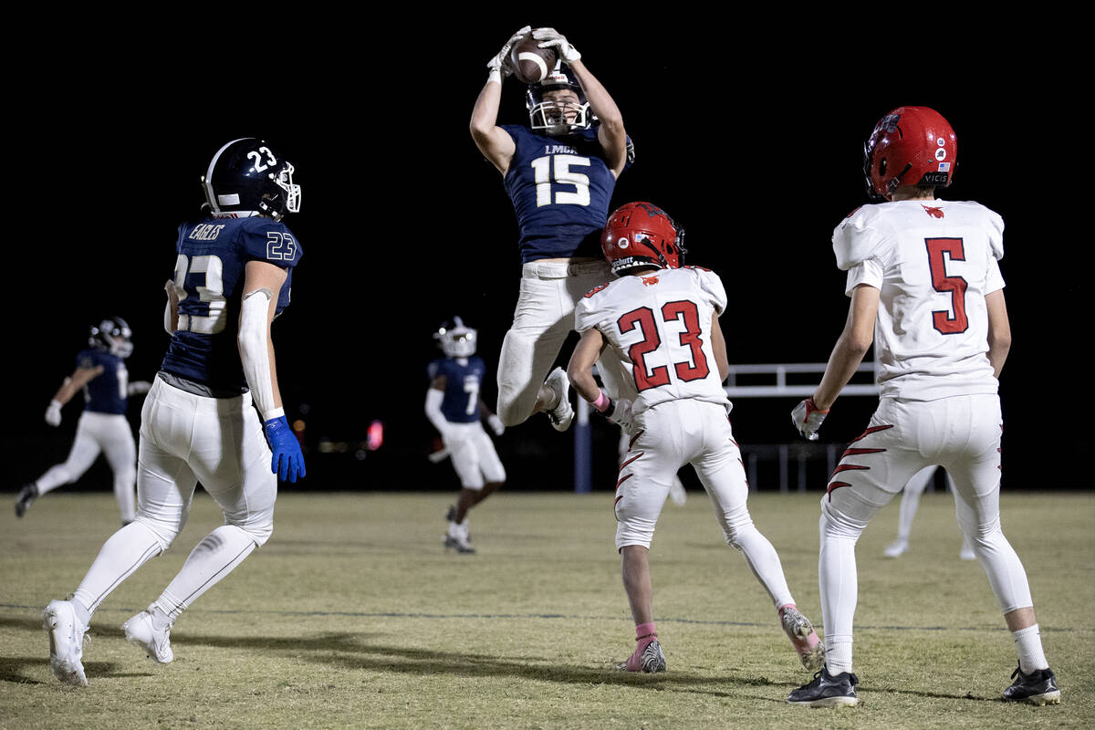 Lake Mead defensive back Gavin Rhodes (15) catches an interception intended for Lincoln County ...