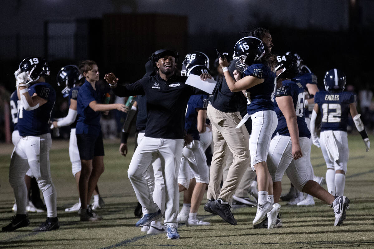Lake Mead kicker Gracie Rhodes (16) celebrates with her coaches after kicking an extra point du ...