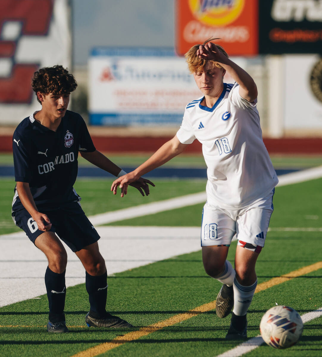 Bishop Gorman’s Jacob Swift (16) kicks the ball as Coronado midfielder Dalton Meusy (6) ...