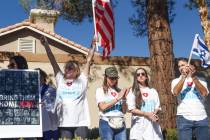 Pro-Israel demonstrators gather in response to graffiti written on a wall in a neighborhood the ...