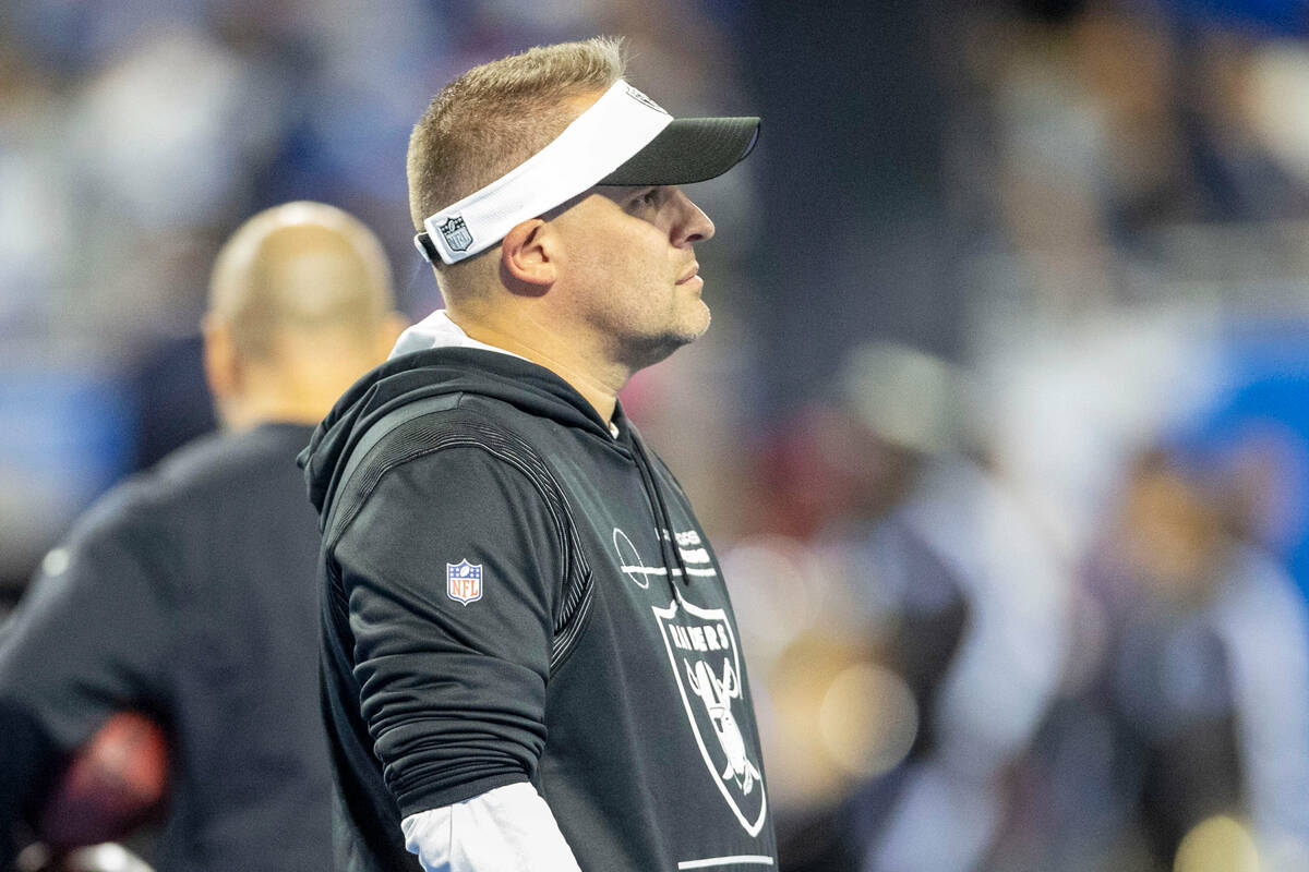 Raiders head coach Josh McDaniels looks on during team warm ups before an NFL game between the ...