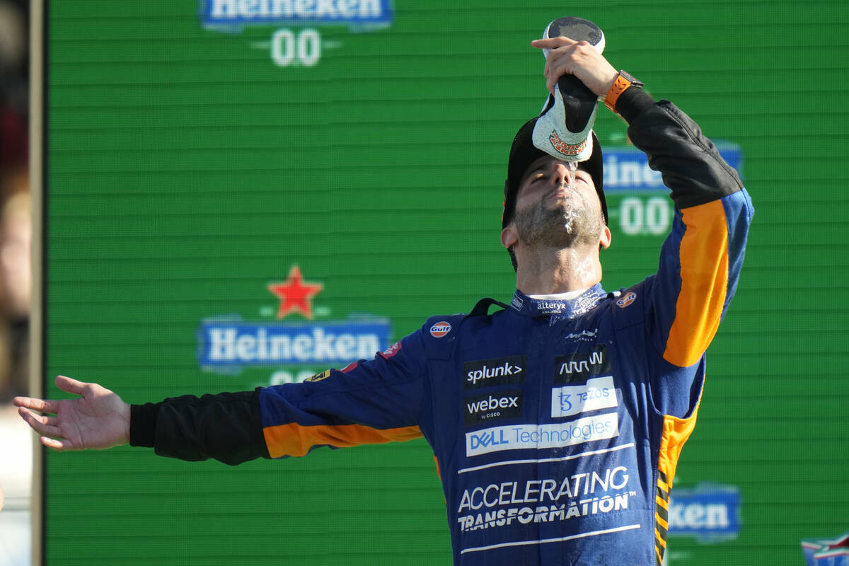 Driver Daniel Ricciardo's tradition of drinking champagne from his shoe to celebrate a victory ...