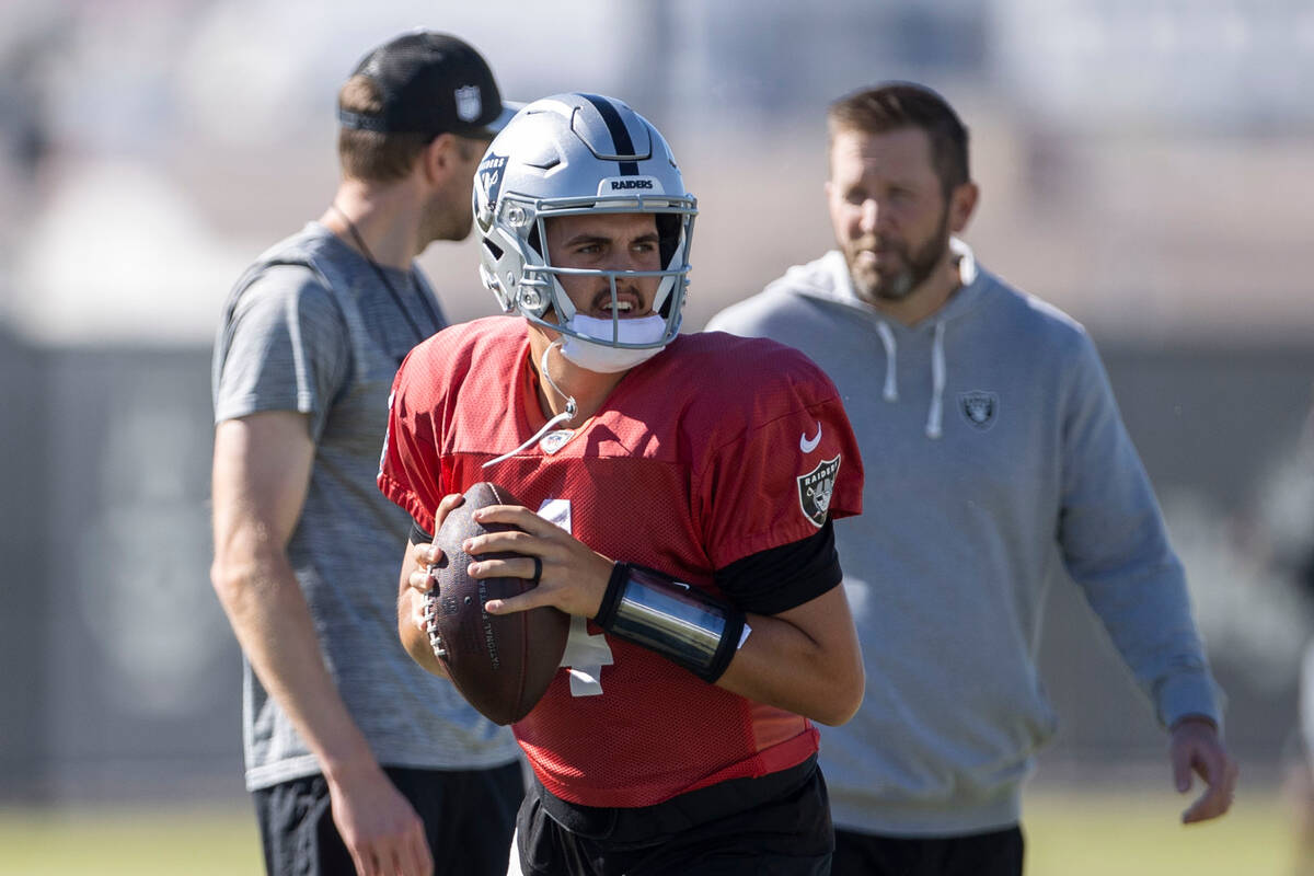 Raiders quarterback Aidan O'Connell (4) gets ready to throw during practice at the Intermountai ...