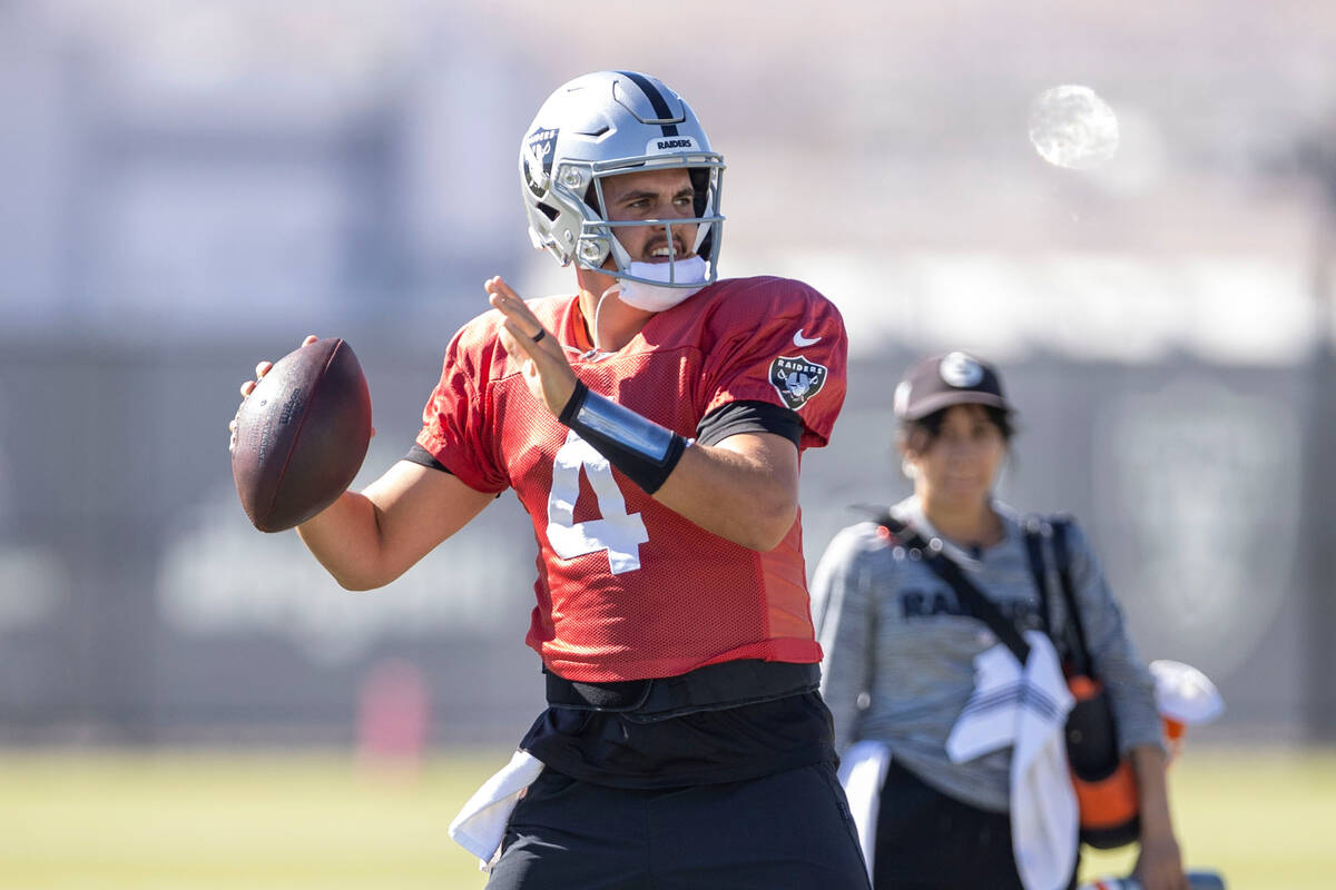 Raiders quarterback Aidan O'Connell (4) gets ready to throw during practice at the Intermountai ...