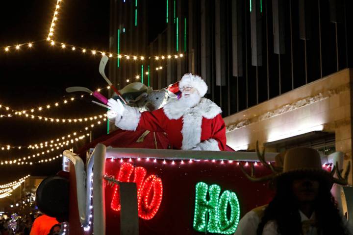 Santa waves during a holiday parade at Downtown Summerlin, Friday, Dec. 3, 2021, in Las Vegas. ...