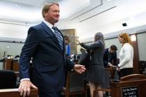 Former Raiders coach Jon Gruden, leaves the courtroom after appearing at a hearing at the Regio ...