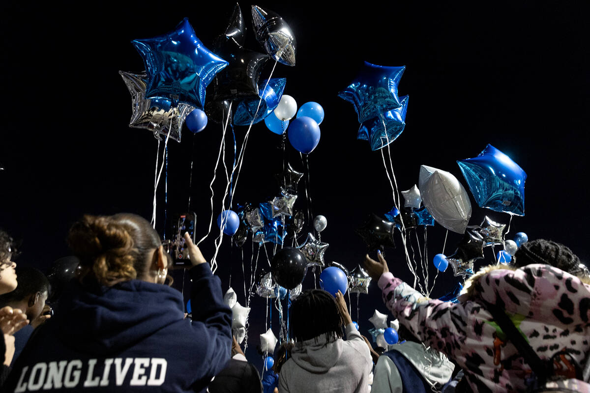 Balloons are release in honor of Desert Pines High School football player, Se’Mauri Norr ...