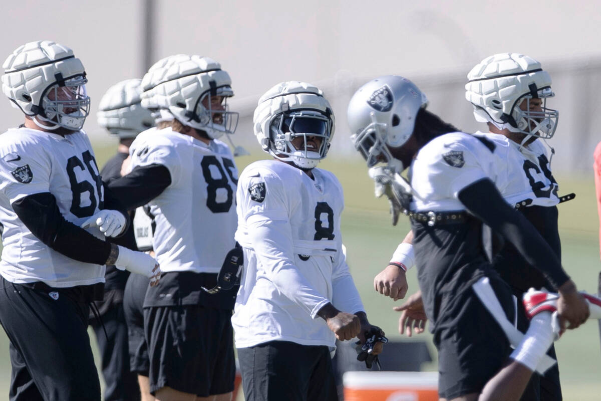 Raiders running back Josh Jacobs (8) smiles as he warms up during practice at the Intermountain ...