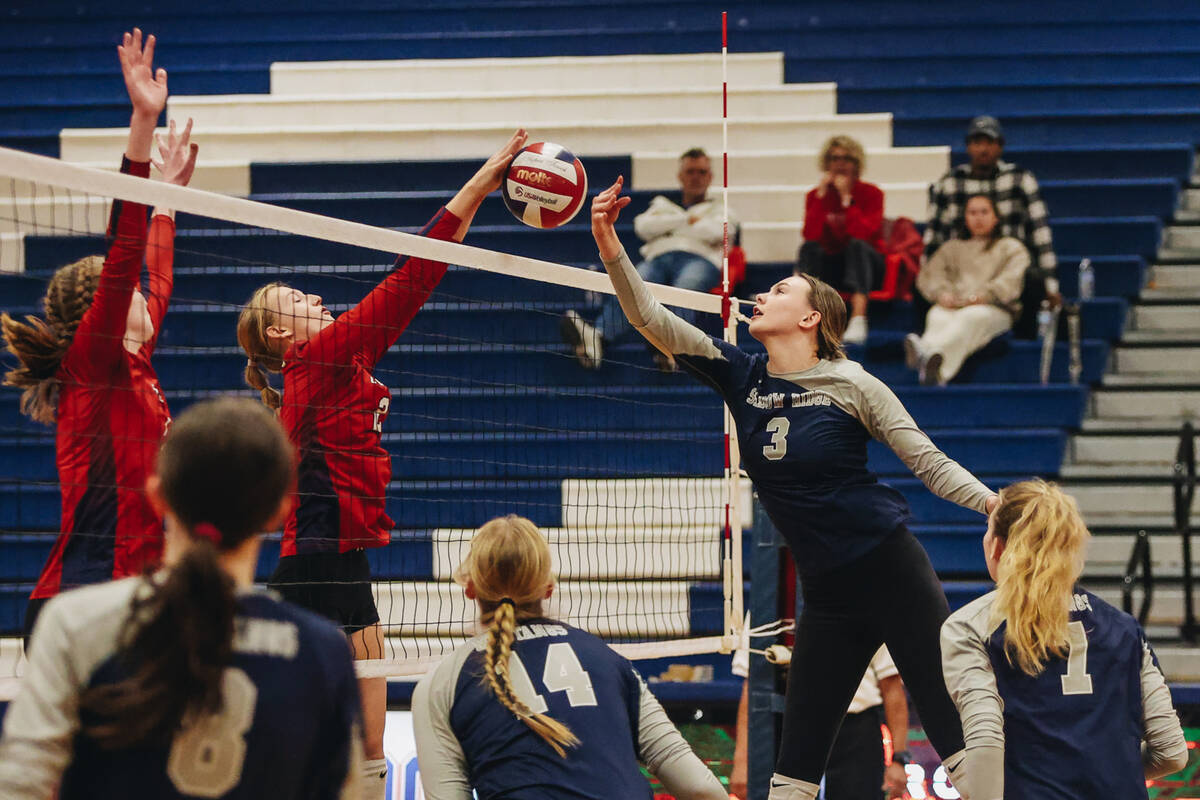 Shadow Ridge’s Lauryn Belt (3) reaches to hit the ball back over the net during a Class ...